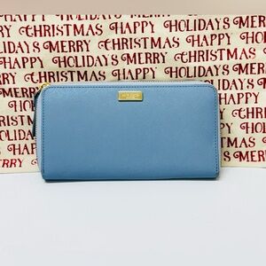 Kate Spade Laurel Way Neda zip-around continental wallet in a "Cloudcover Blue"